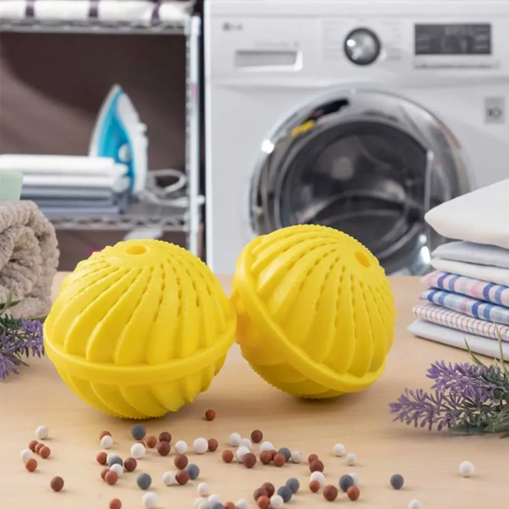 Pack de 2 bolas para limpiar la ropa Delieco InnovaGoods sin detergente amarillo Ø10,5x9,4 cm